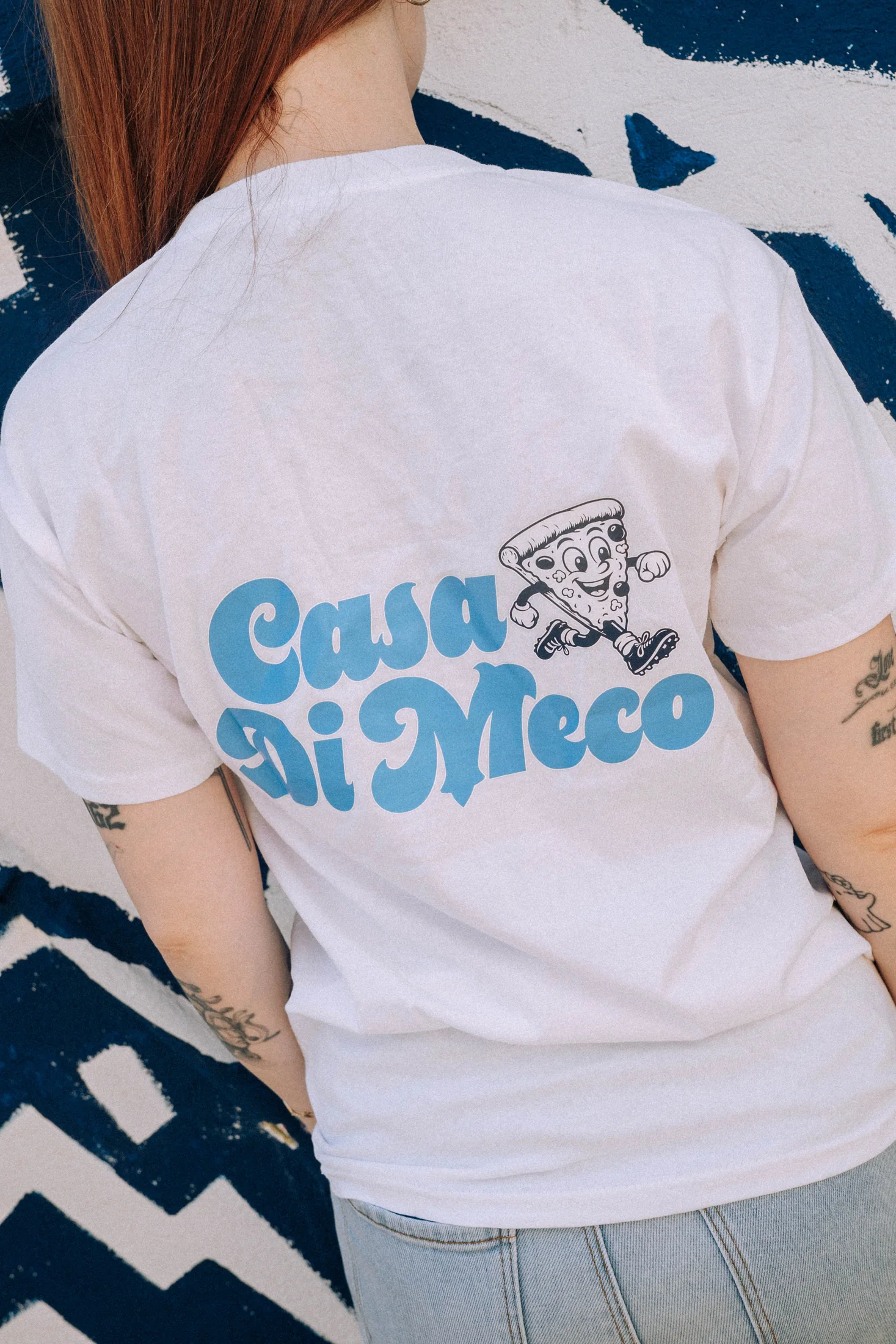 Logo Casa Di Meco au dos d'un tee-shirt